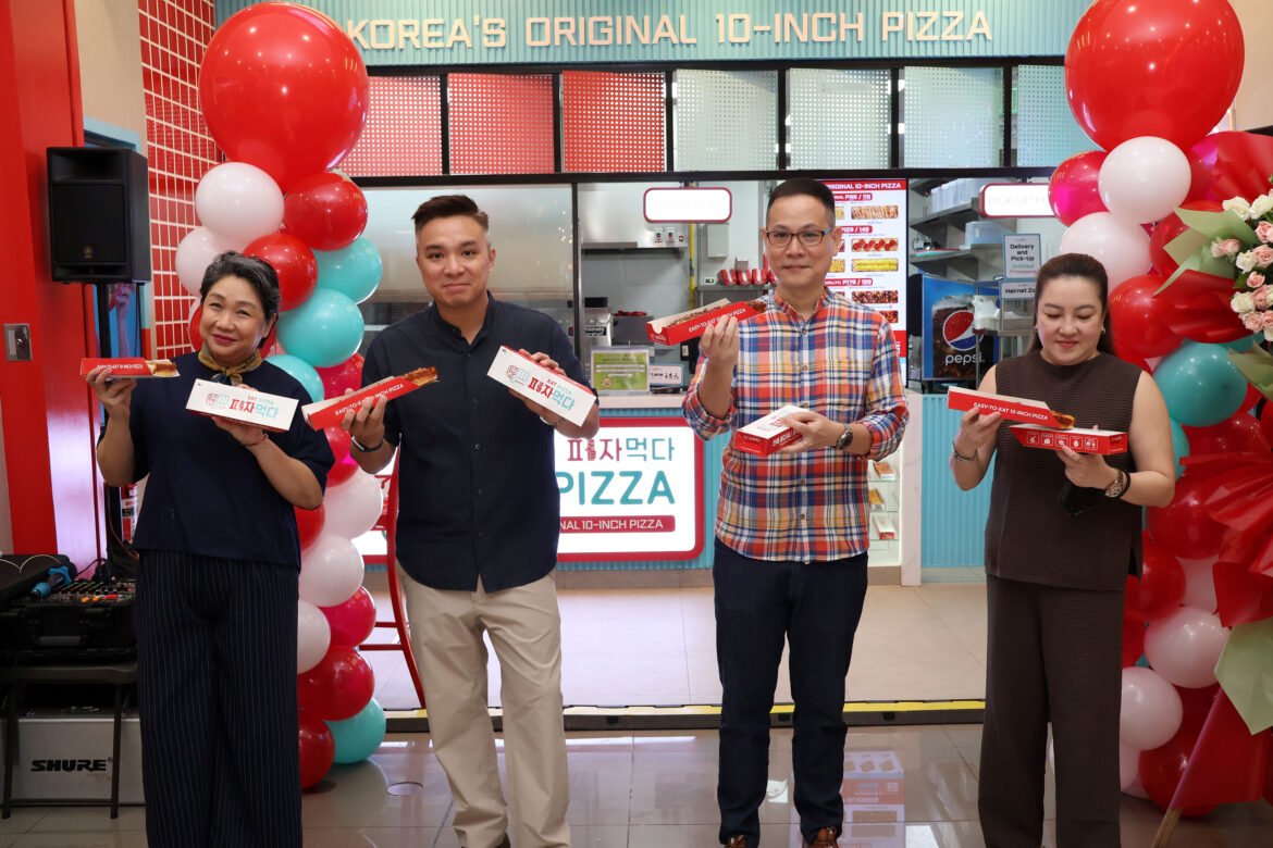 Scotland Food Group Corporation Executives savoring their delicious pizza slides at the celebratory pizza toast.